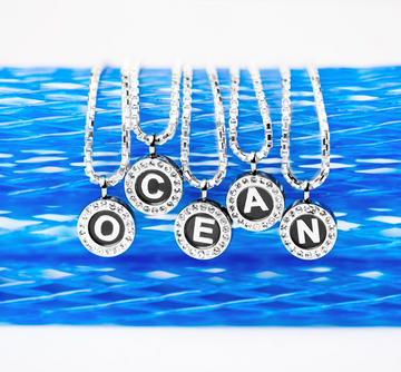 Our letter necklace collection spelling OCEAN