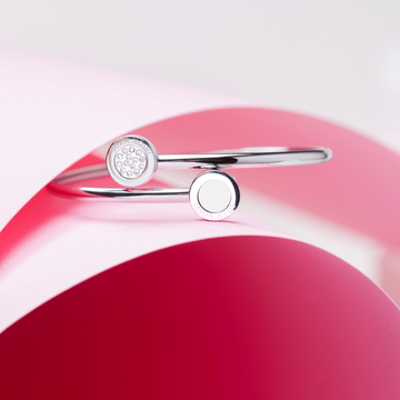 Silver bangle with white sustainable enamel and zirconia accents