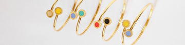 A horizontal shot of modern gold bracelets