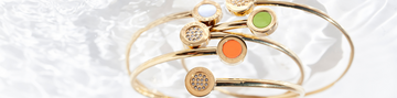 Gold plated bangle bracelets with white, orange and lime green chips and zirconia