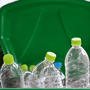 Gif of plastic bottles with green caps in a trash can