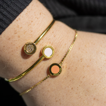White and pave chip bangle with a apricot crush sustainable chip bracelet.