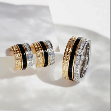 Still-life of Jason Hyde rings, emphasizing a modern and elegant stacked ring collection.