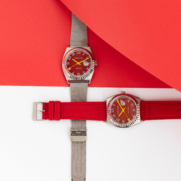 Two Jason Hyde watches with red dials and silver accents
