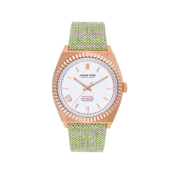 GOLD-TONE WATCH WITH ELABORATE BAND AND WHITE FACE.