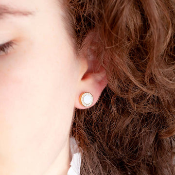 A close-up of an ear wearing a Jason Hyde Ocean Earring