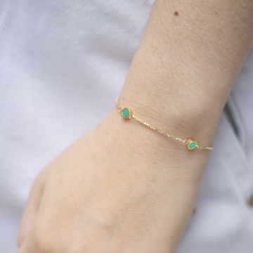 Jason Hyde gold bracelet with minimalist round turquoise enamel charms