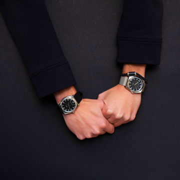 Model wearing jason hyde '#uno' 40mm watch with all-black dial and strap.