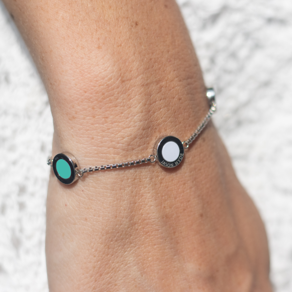 Jason Hyde silver chain bracelet with turquoise and white circular charms.