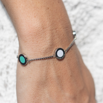 Jason Hyde silver chain bracelet with turquoise and white circular charms.