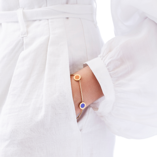Gold chain bracelet with apricot crush and persian blue enamel circle pendants