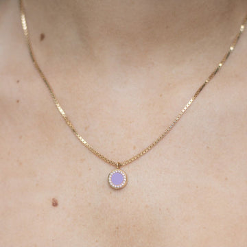 Eco-friendly gold necklace with lavender chip pendant bordered by zirconia