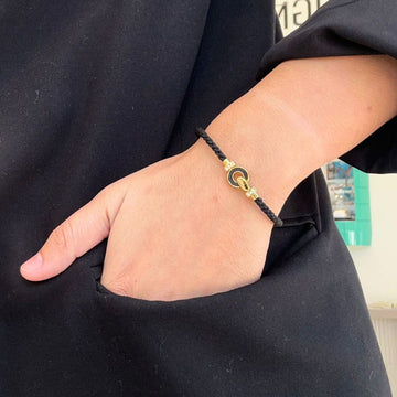Jason Hyde Nereida black cord bracelet with gold clasp.