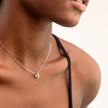 Women’s eco-friendly silver necklace with circular pendant, Jason Hyde