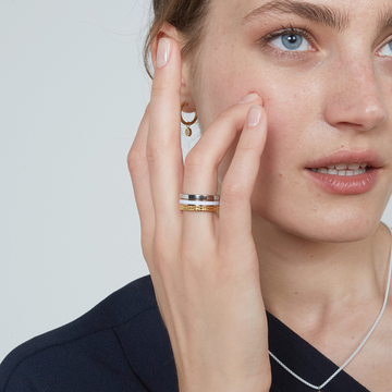 Woman wearing Jason Hyde mixed metal stacked rings