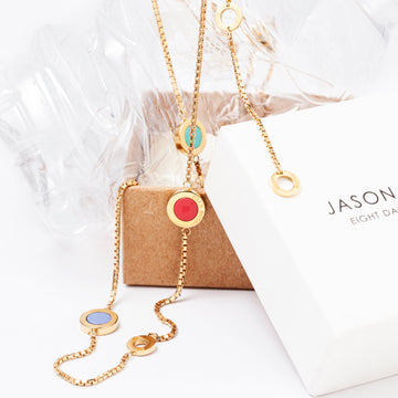 Jason Hyde gold necklace with colorful circular charms.