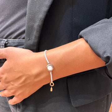 Wrist wearing a delicate Ocean white chip bracelet