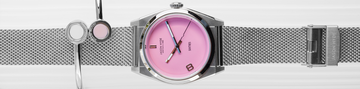 Silver Sixty 8 watch with pink dial and silver bangle bracelet with pink and white chips