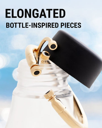 Gold jewelry with black details, inspired by the shape of a bottle.