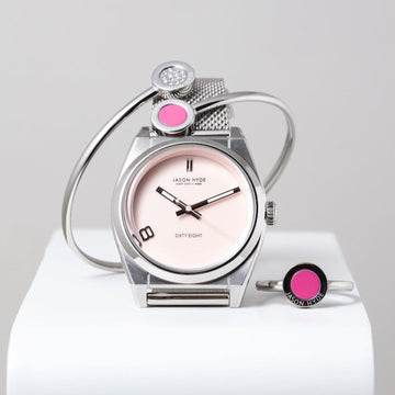 Jason Hyde silver watch, matching pink enamel bracelet, and ring.