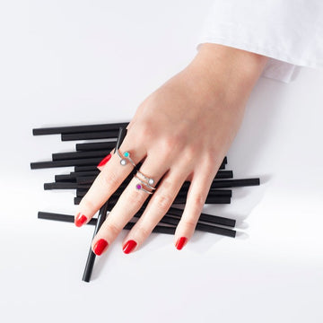 Hand with three silver rings by Jason Hyde