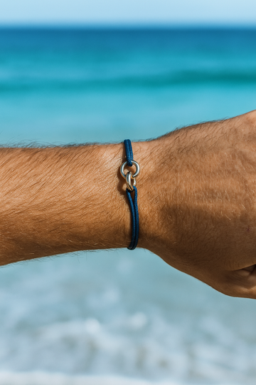 Man wrist wearing SAYMA collection bracelet in navy cord