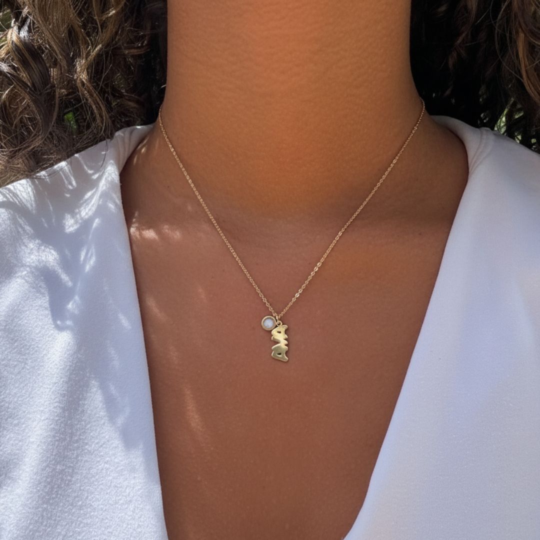 Jason Hyde Aquaname gold plated vertical necklace "AVA" with white recycled charm.