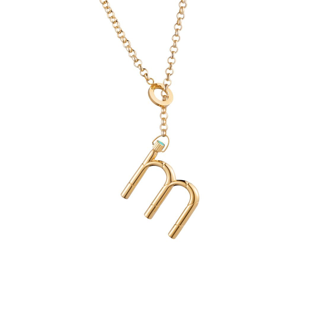 Stylish gold necklace with a personalized letter "m" charm.