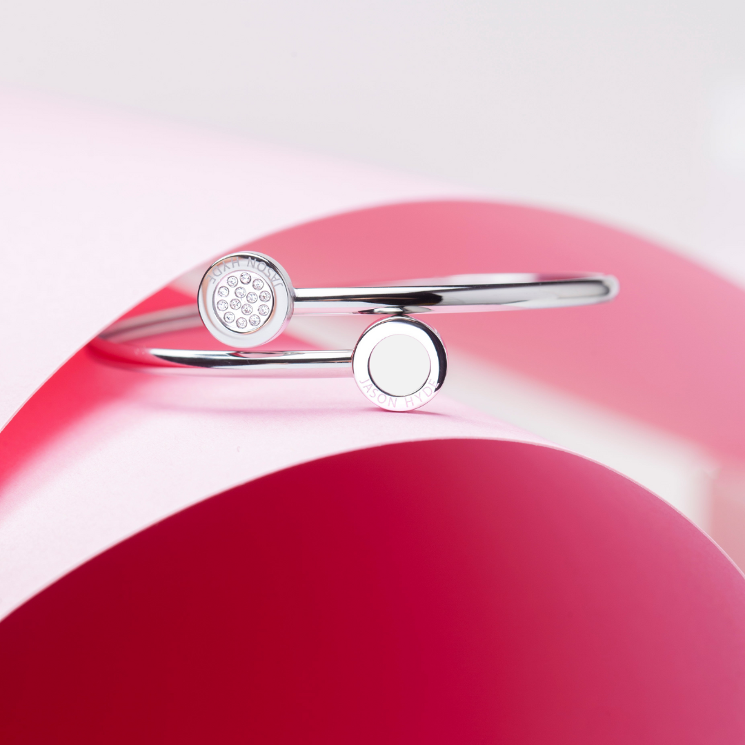 Silver bangle with white sustainable enamel and zirconia accents