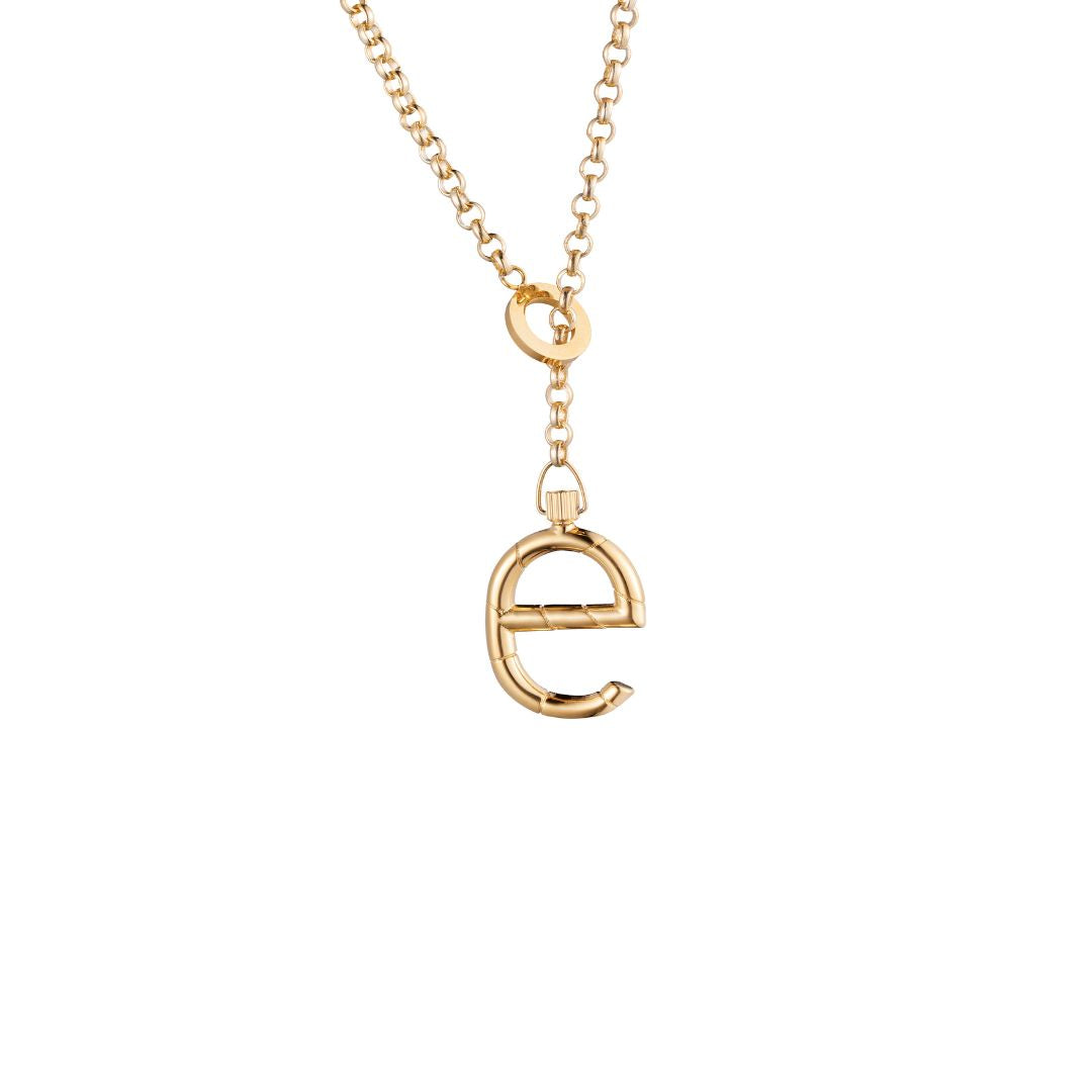 A gold lariat necklace with a polished lowercase 'e' letter pendant