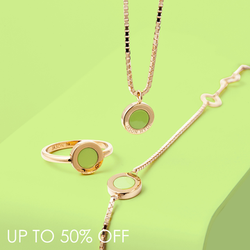 Minimalist gold jewelry set including a necklace, ring, and chain bracelet with lime green enamel accents.