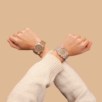 Two matching silver-cased watches with brown sunburst dials