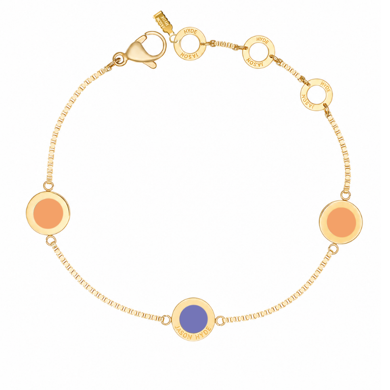 Gold chain bracelet with two circular pendants in "Apricot Crush" tone and a Persian blue pendant