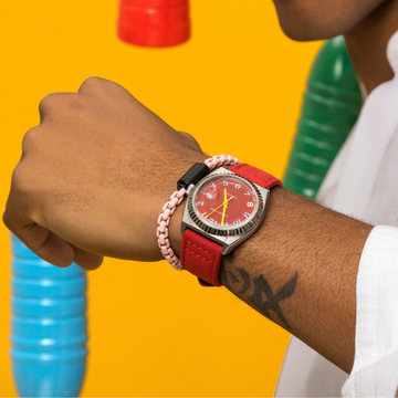 Man with tattoo on wrist showing a Jason Hyde watch