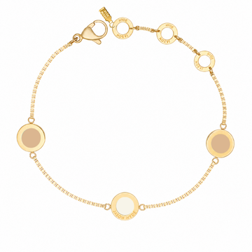Gold box-chain bracelet featuring round beige and cappuccino charms