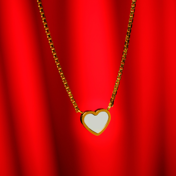 A gold box chain necklace featuring a heart-shaped pendant with a white inlay