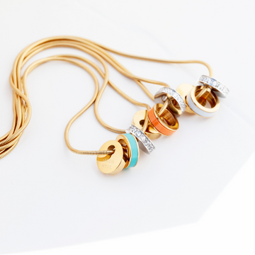 3 Wewa necklaces with gold chain and each with turquoise, orange and white chips