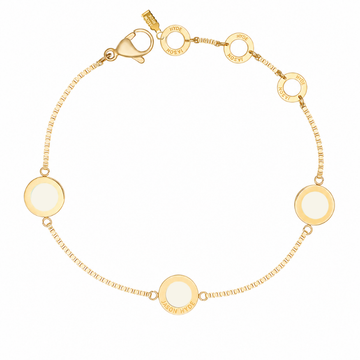 Gold bracelet with round cappuccino charms by Jason Hyde.