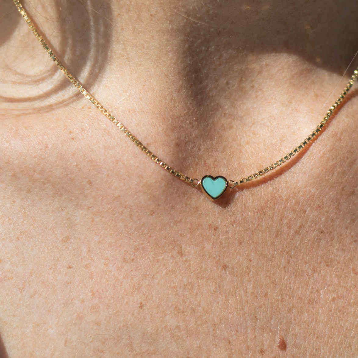 14k gold plated necklace with a turquoise heart pendant.