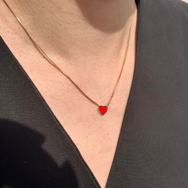 Sustainable 14k gold plated necklace with a minimalist red heart pendant.