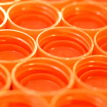 gif of orange plastic caps