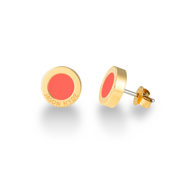 Round stud earrings with coral enamel by Jason Hyde