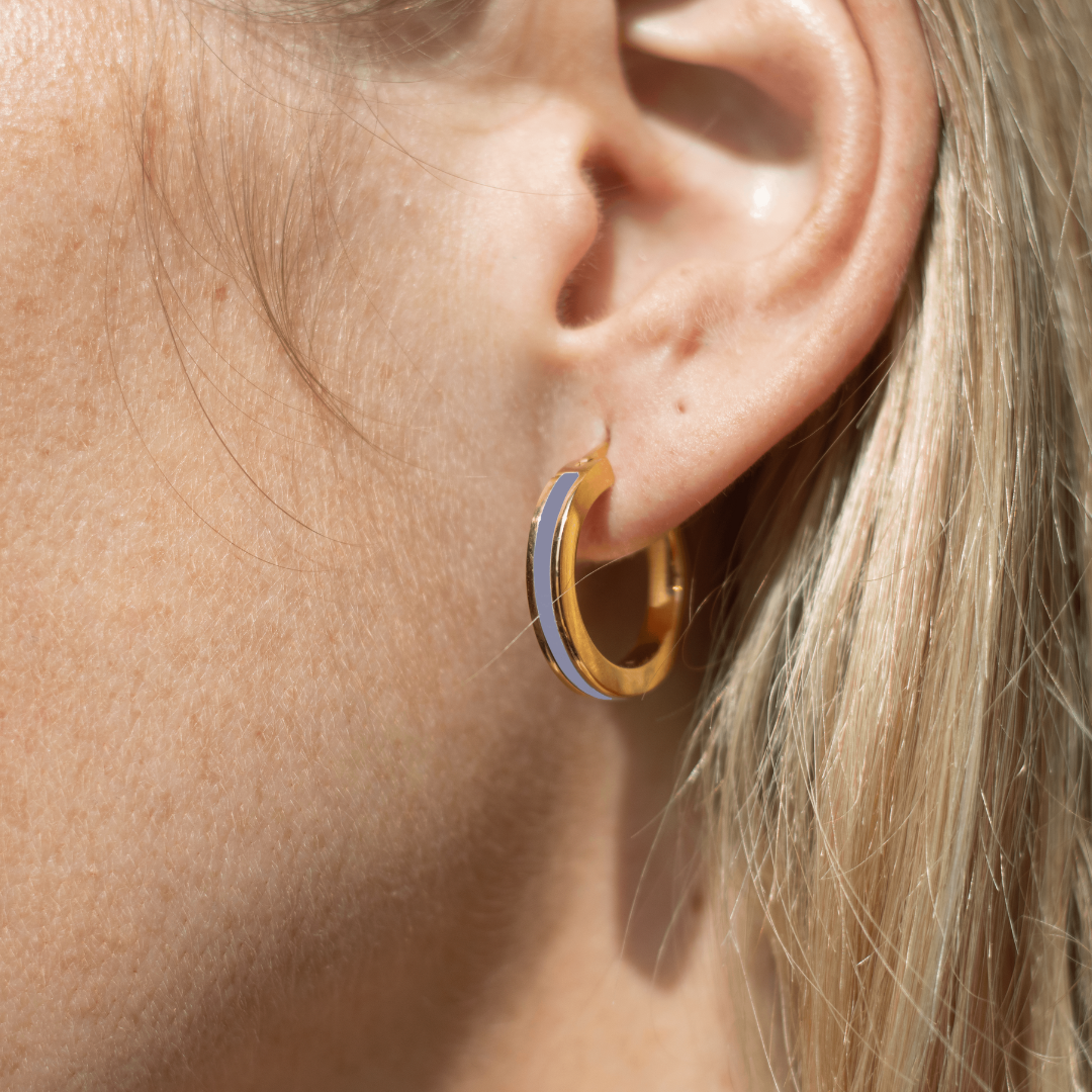 Chic hoop earring showcasing a sustainable persian blue accent.