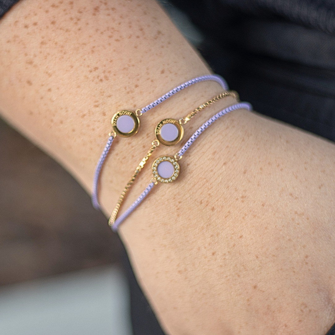 Set of three Jason Hyde sustainable lavender jewelry pieces.