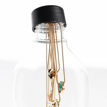 A creative product shot of several Jason Hyde gold-tone necklaces