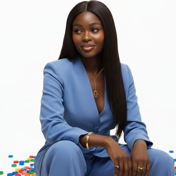 Woman in a blue suit, wearing gold jewelry