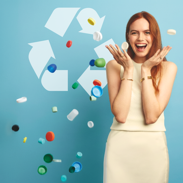 Smiling woman, surrounded by various colorful plastic bottle caps floating in the air