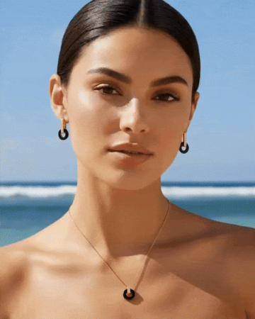 GIF of a woman modeling Jason Hyde earrings and necklace from the Lifesaver collection
