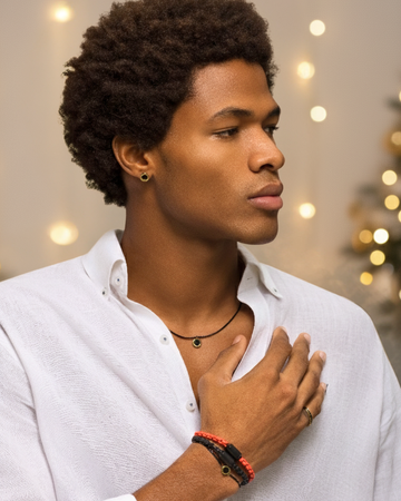 Man in white shirt modeling black Jason Hyde jewelry