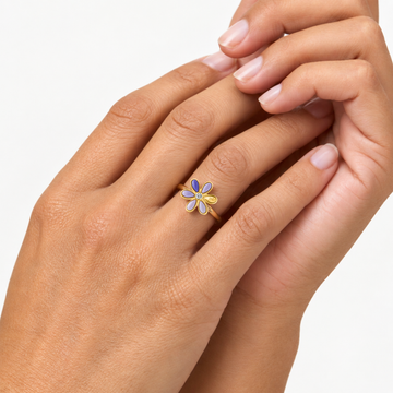 Gold-tone flower ring with lavender enamel petals and yellow accents